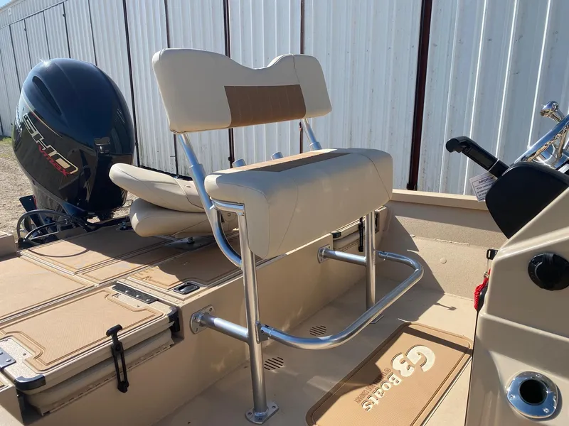 Slide: The Image of 2025 G3 Bay 21 GX boat interior with seating and outboard motor. - 9