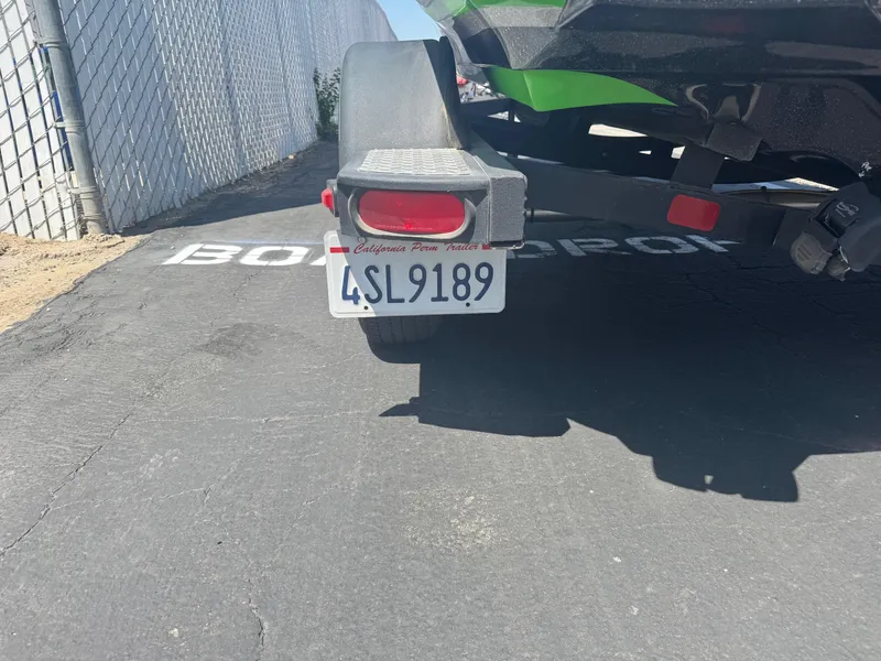 Slide: The Image of Trailer with California license plate on a Nitro Z18, 2018 model, parked on asphalt. - 10