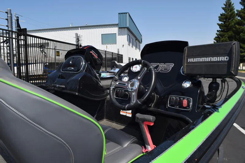 Slide: The Image of Interior of a 2018 Nitro Z18 boat with steering wheel and Humminbird electronics. - 3