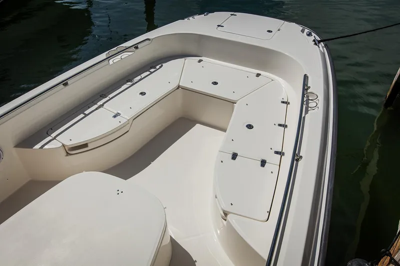 Slide: The Image of 2021 Boston Whaler 270 Dauntless boat interior with spacious seating and storage compartments. - 14