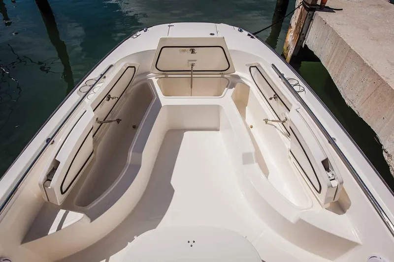 Slide: The Image of 2021 Boston Whaler 270 Dauntless boat interior with open storage compartments. - 15