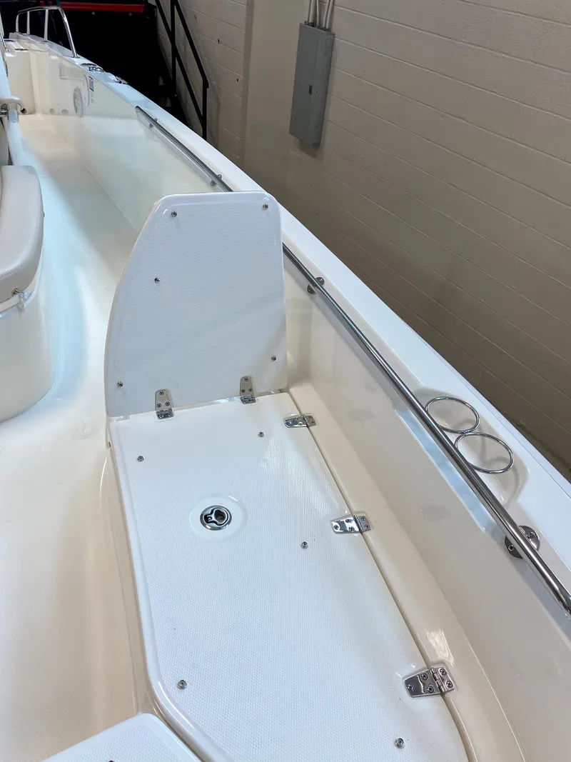 Slide: The Image of 2021 Boston Whaler 270 Dauntless boat interior with white deck and stainless steel fittings. - 21