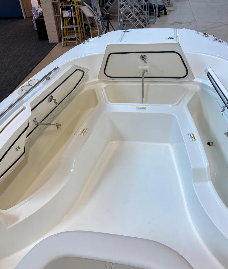 Slide: The Image of 2021 Boston Whaler 270 Dauntless boat interior with spacious seating and storage compartments. - 33