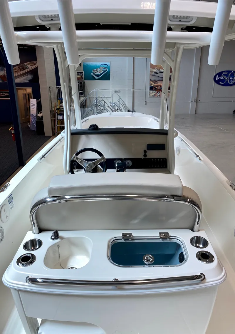 Slide: The Image of 2021 Boston Whaler 270 Dauntless boat interior with helm and seating area. - 4