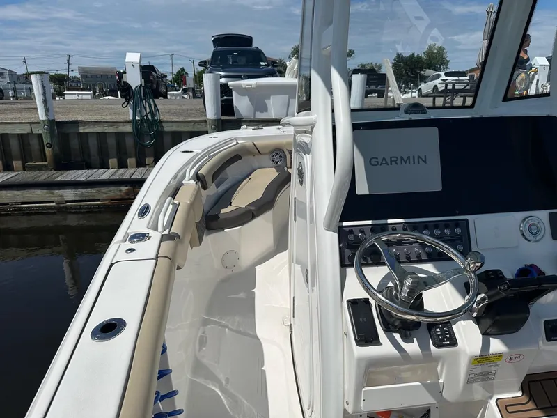 Slide: The Image of 2021 Tidewater 252 LXF boat interior with Garmin navigation system at dock. - 6