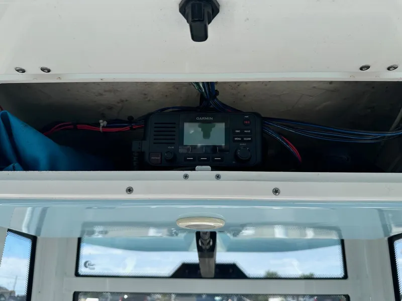 Slide: The Image of Garmin radio installed in a 2021 Tidewater 252 LXF boat's storage compartment. - 9