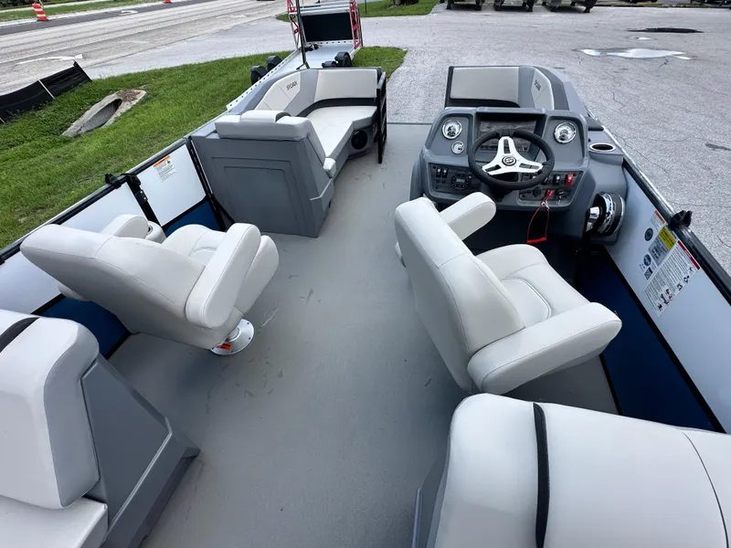 Slide: The Image of Interior of 2026 Sylvan A22 LZ Sport boat with modern seating and dashboard. - 8