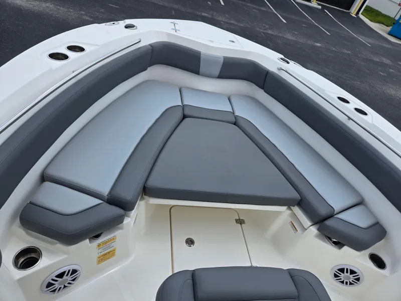 Slide: The Image of 2023 NauticStar 242L Offshore boat with spacious seating and modern design. - 12