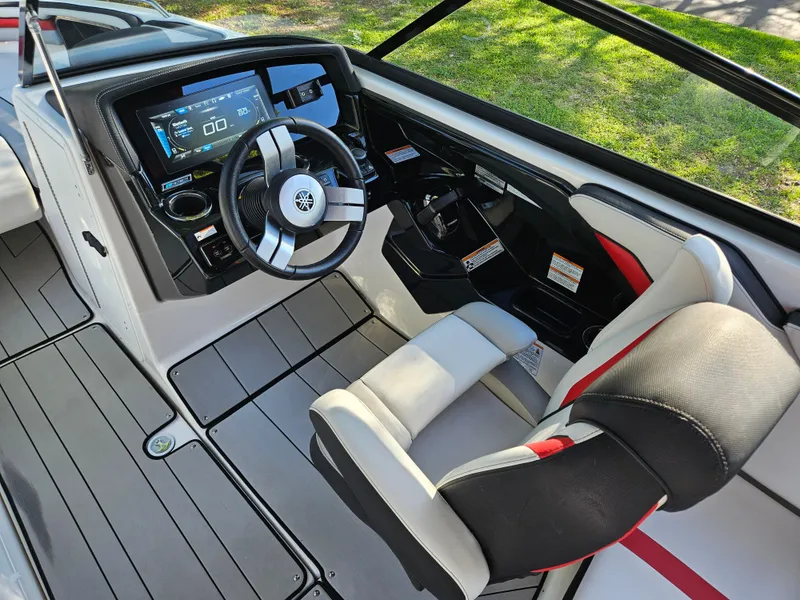 Slide: The Image of 2020 Yamaha Boats 242X cockpit with modern dashboard and comfortable seating. - 11