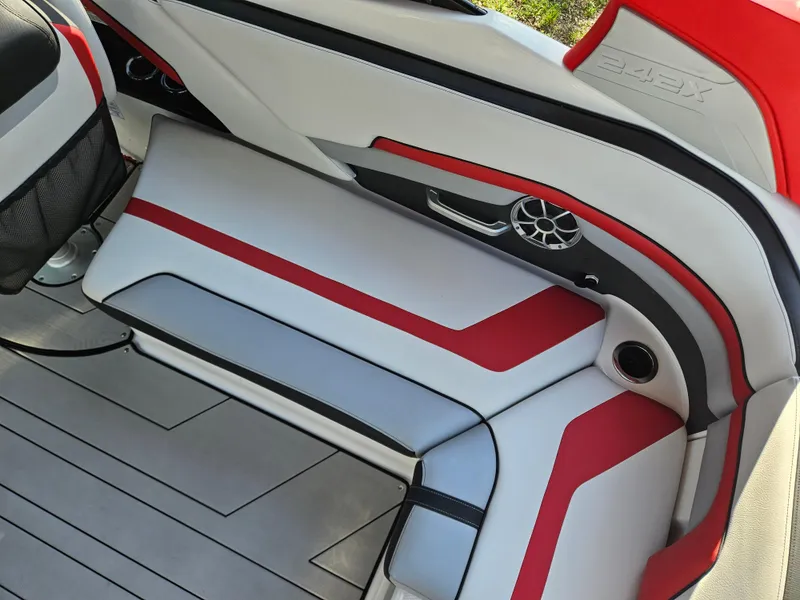 Slide: The Image of 2020 Yamaha Boats 242X interior seating with red and white upholstery. - 18