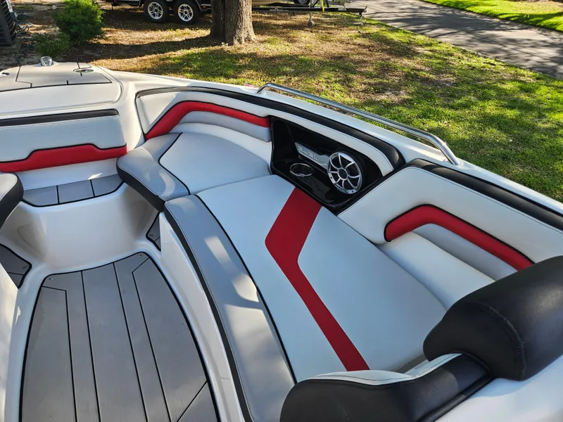 Slide: The Image of 2020 Yamaha Boats 242X interior with red and gray seating. - 5