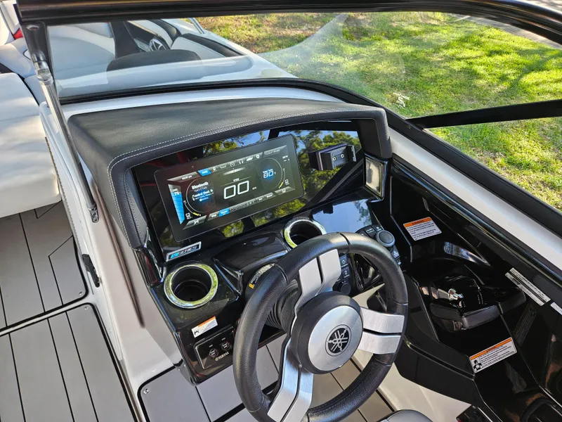 Slide: The Image of 2020 Yamaha Boats 242X dashboard with touchscreen display and steering wheel. - 8