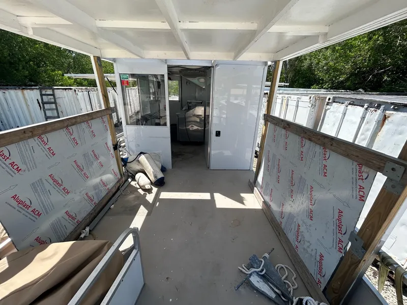 Slide: The Image of Interior of a 2006 3D Craft food truck under renovation, featuring AluPlast ACM panels. - 5