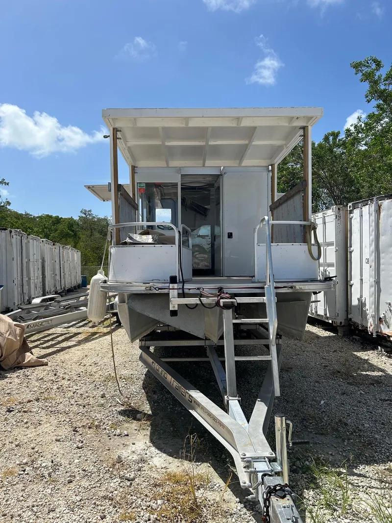 Slide: The Image of 3D Craft 2006 food truck on gravel lot, surrounded by storage containers. - 6
