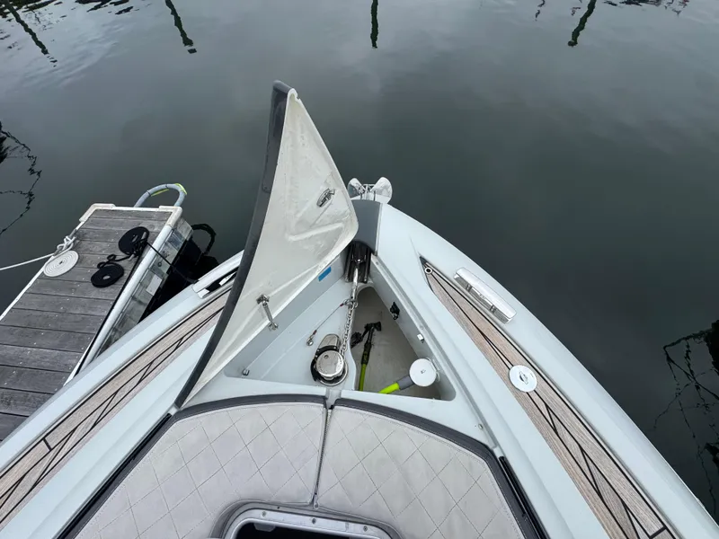 Slide: The Image of 2021 Fairline F//Line 33 yacht bow with open anchor hatch at dock. - 1