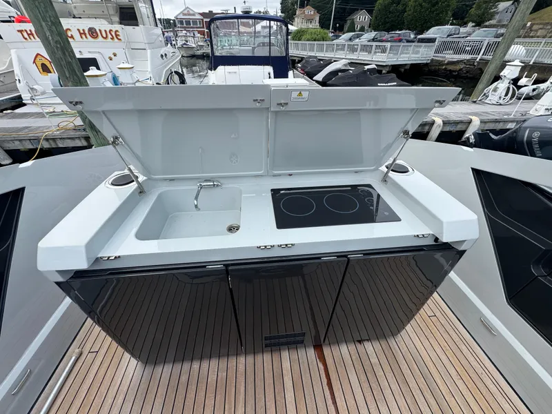 Slide: The Image of Outdoor kitchen on 2021 Fairline F//Line 33 yacht with sink and stove. - 11
