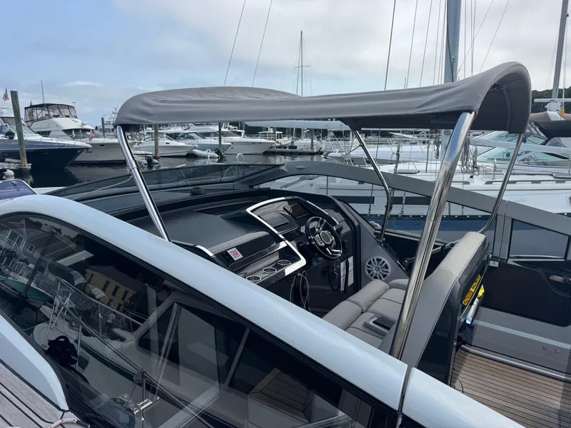 Slide: The Image of 2021 Fairline F//Line 33 yacht interior with sleek design at marina. - 15