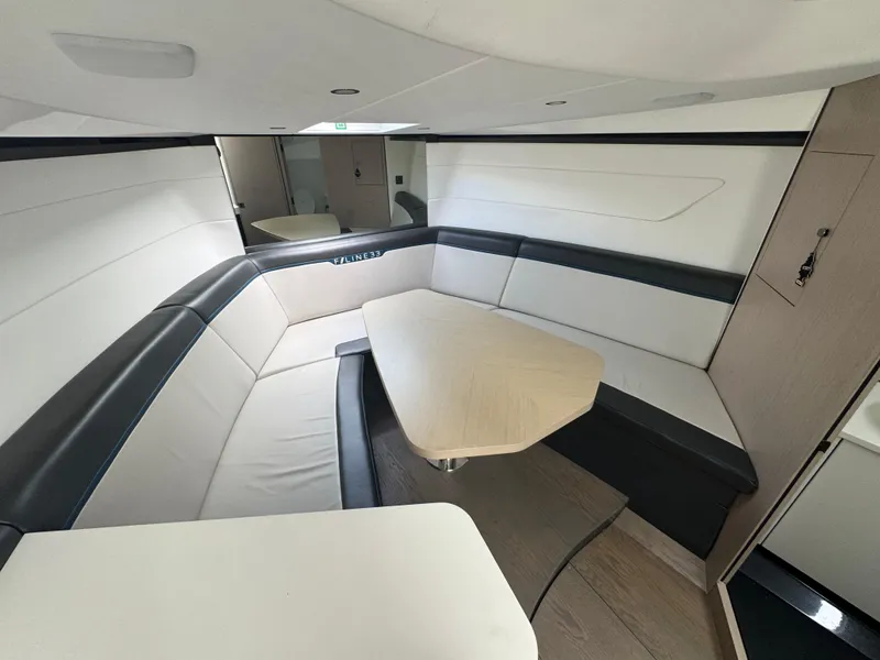 Slide: The Image of Interior of 2021 Fairline F//Line 33 yacht with modern seating and table. - 16