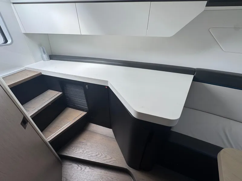 Slide: The Image of Interior of 2021 Fairline F//Line 33 yacht with modern cabinetry and stairs. - 18