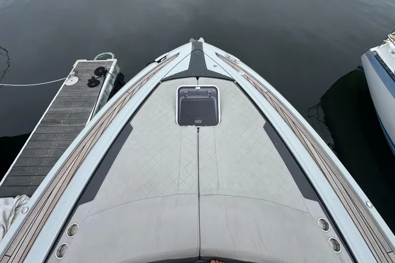 Slide: The Image of Bow view of 2021 Fairline F//Line 33 yacht docked at marina. - 2