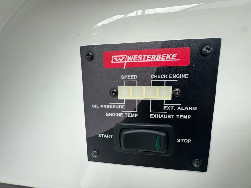 Slide: The Image of Control panel on a 2021 Fairline F//Line 33 boat, featuring Westerbeke engine indicators. - 20