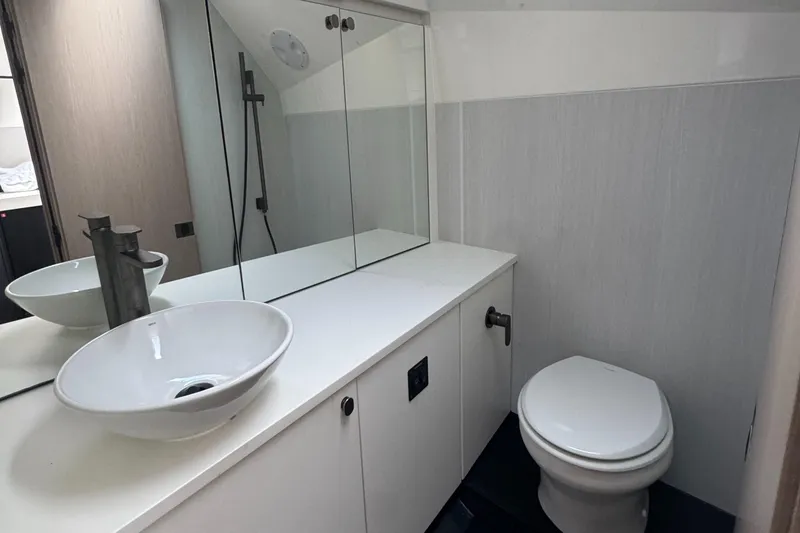 Slide: The Image of Modern bathroom in 2021 Fairline F//Line 33 yacht with sleek sink and toilet. - 25