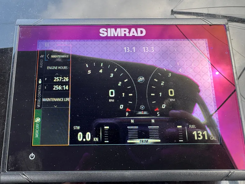 Slide: The Image of Simrad display on 2021 Fairline F//Line 33 showing engine hours and fuel level. - 7