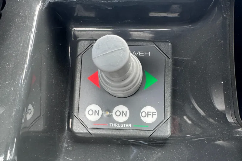 Slide: The Image of Joystick control panel on 2021 Fairline F//Line 33 boat, featuring thruster controls. - 8