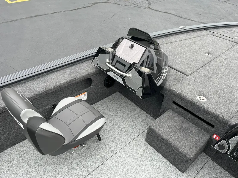 Slide: The Image of 2026 Lund 2075 Pro-V Bass XS boat interior with seating and control panel. - 12