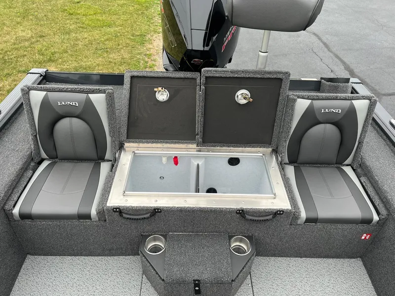 Slide: The Image of 2026 Lund 2075 Pro-V Bass XS boat interior with seating and storage compartments. - 13