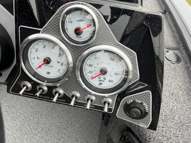 Slide: The Image of Dashboard of 2026 Lund 2075 Pro-V Bass XS boat with gauges and controls. - 17