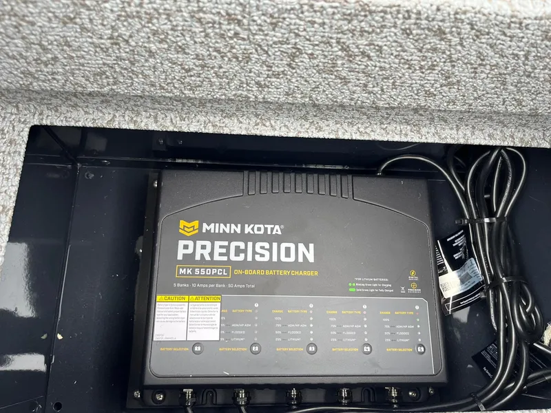 Slide: The Image of Minn Kota Precision MK 550PCL on-board battery charger in Lund 2075 Pro-V Bass XS. - 26