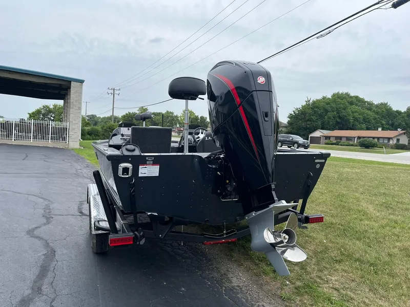 Slide: The Image of 2026 Lund 2075 Pro-V Bass XS boat with powerful outboard motor on trailer. - 3