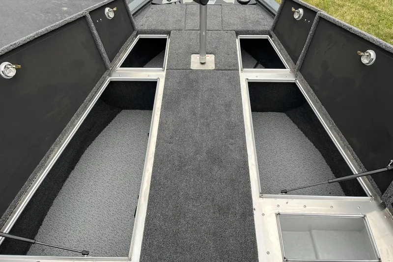 Slide: The Image of 2026 Lund 2075 Pro-V Bass XS boat interior with open storage compartments. - 9