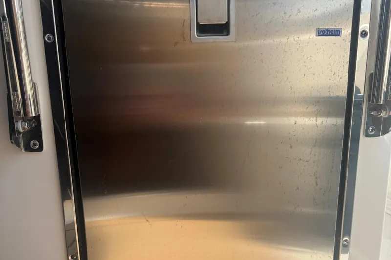 Slide: The Image of Stainless steel door on 2023 Tiara Yachts 34 LS, featuring Isotherm branding. - 6