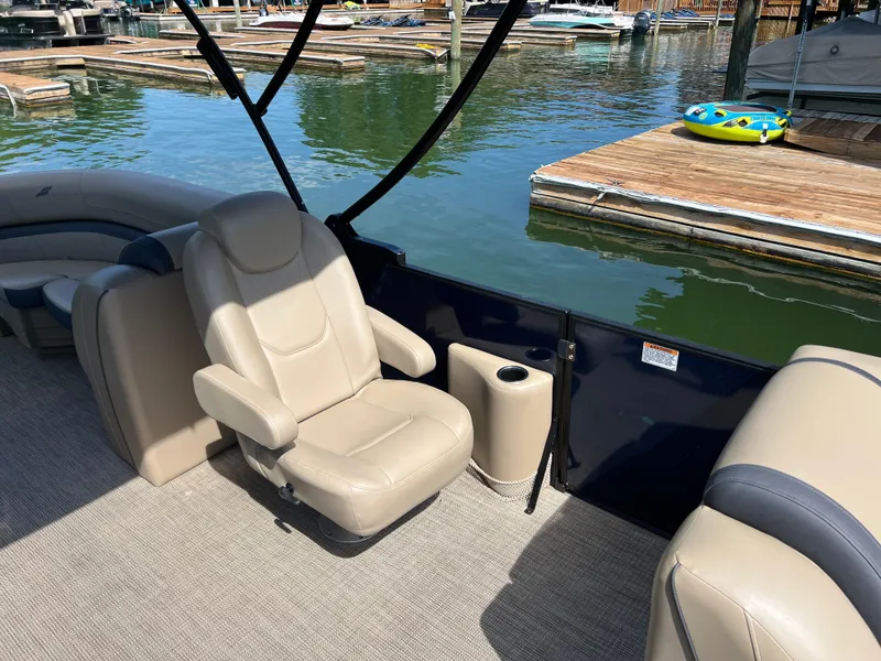 Slide: The Image of Luxurious seating on 2025 Starcraft EXS 3 boat at marina. - 13