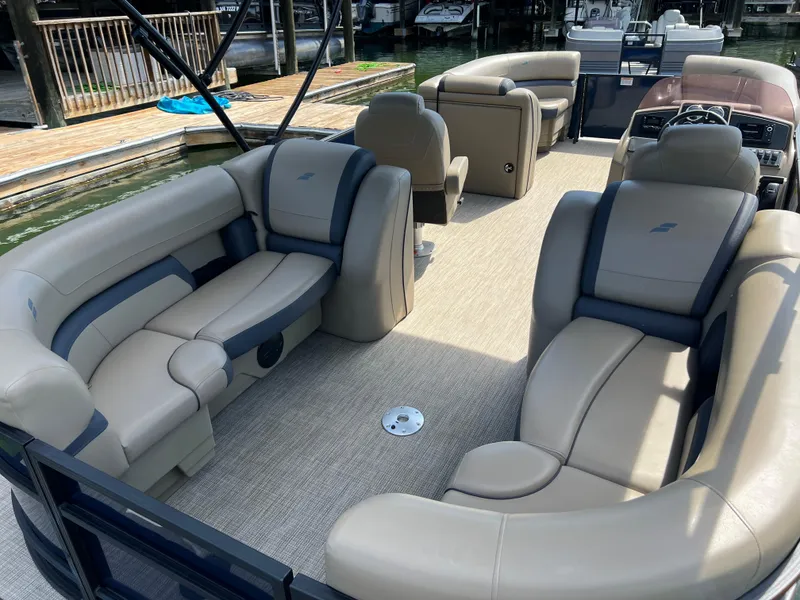 Slide: The Image of 2025 Starcraft EXS 3 pontoon boat interior with luxurious seating and modern design. - 17