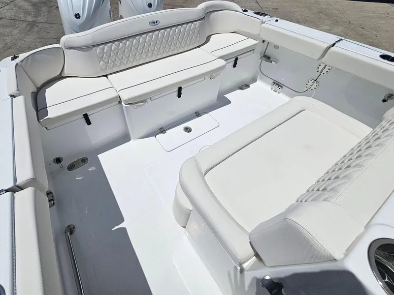 Slide: The Image of 2026 Sea Hunt Ultra 275 SE boat interior with white cushioned seating. - 12