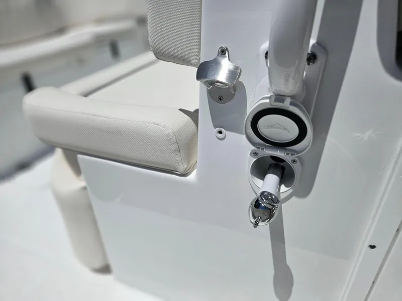 Slide: The Image of 2026 Sea Hunt Ultra 275 SE boat detail with white upholstery and chrome fixtures. - 16