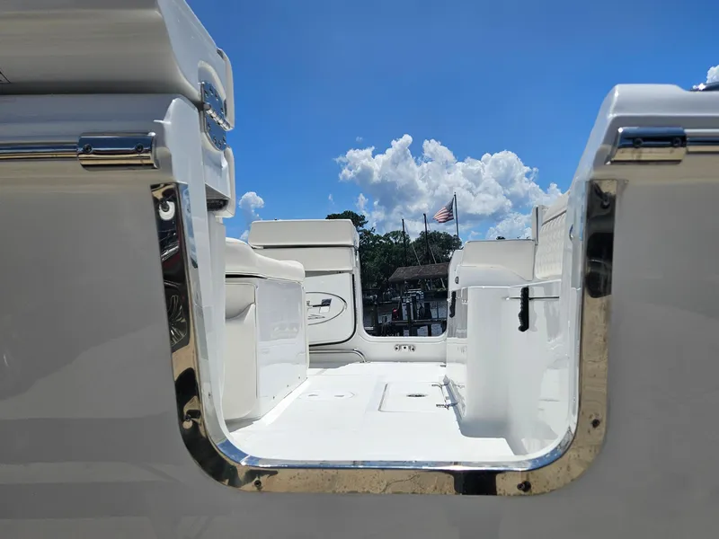 Slide: The Image of 2026 Sea Hunt Ultra 275 SE boat interior with open deck and clear blue sky. - 2
