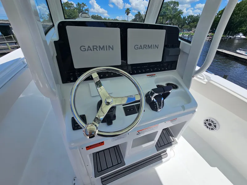 Slide: The Image of 2026 Sea Hunt Ultra 275 SE helm with dual Garmin displays and steering wheel. - 21