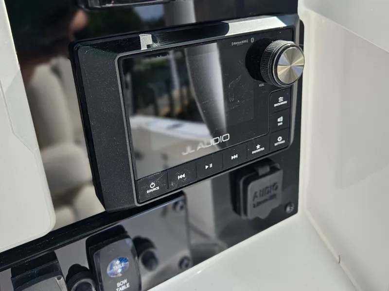 Slide: The Image of JL Audio system on 2026 Sea Hunt Ultra 275 SE boat dashboard. - 24