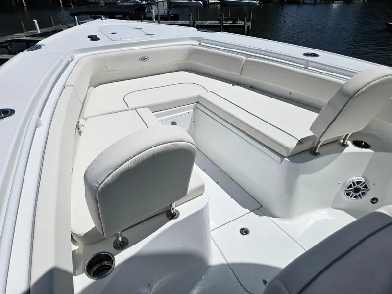 Slide: The Image of 2026 Sea Hunt Ultra 275 SE boat interior with white cushioned seating. - 26