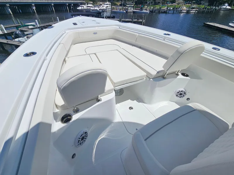 Slide: The Image of 2026 Sea Hunt Ultra 275 SE boat interior with white seating and waterfront view. - 27