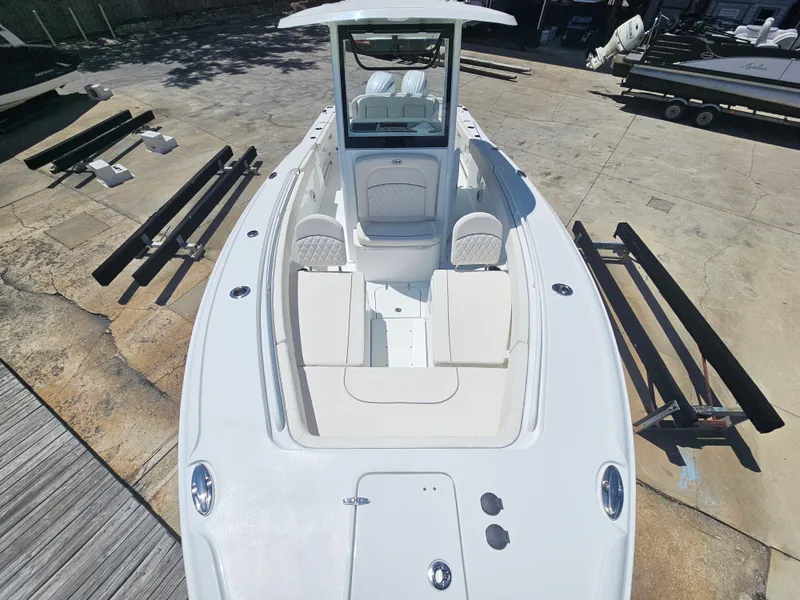 Slide: The Image of 2026 Sea Hunt Ultra 275 SE boat, top view, showcasing spacious seating and sleek design. - 31