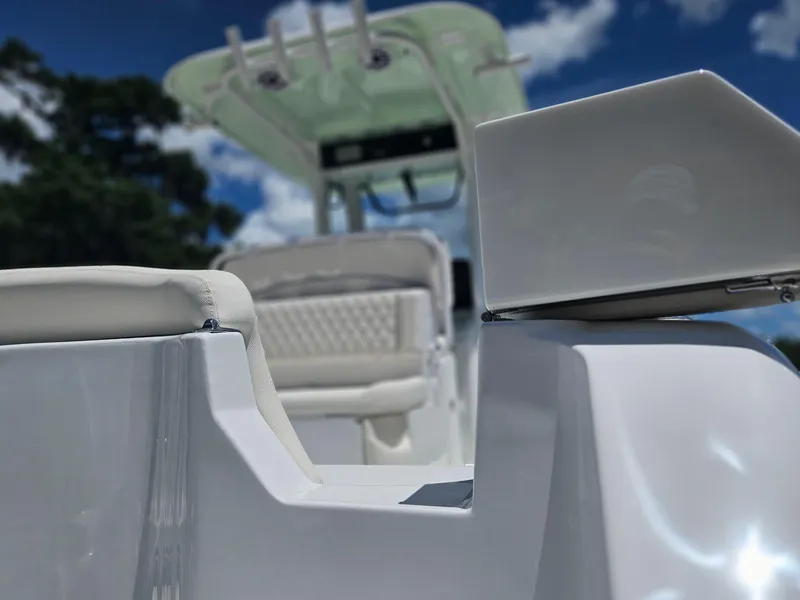 Slide: The Image of 2026 Sea Hunt Ultra 275 SE boat interior, featuring sleek white seating and modern design. - 5