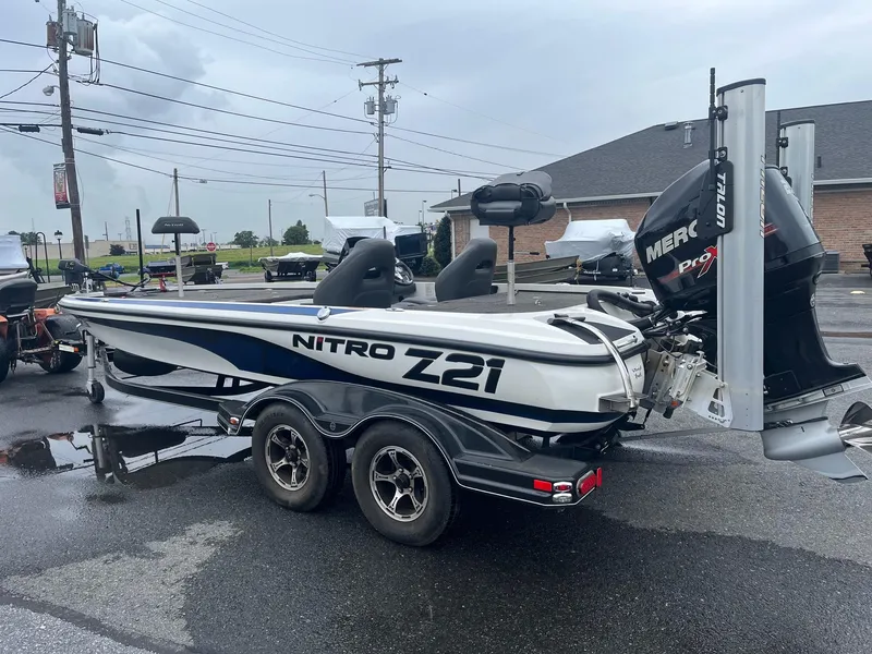 Slide: The Image of 2015 Nitro Z21 Z-Pro High Performance boat on trailer, parked outdoors. - 19