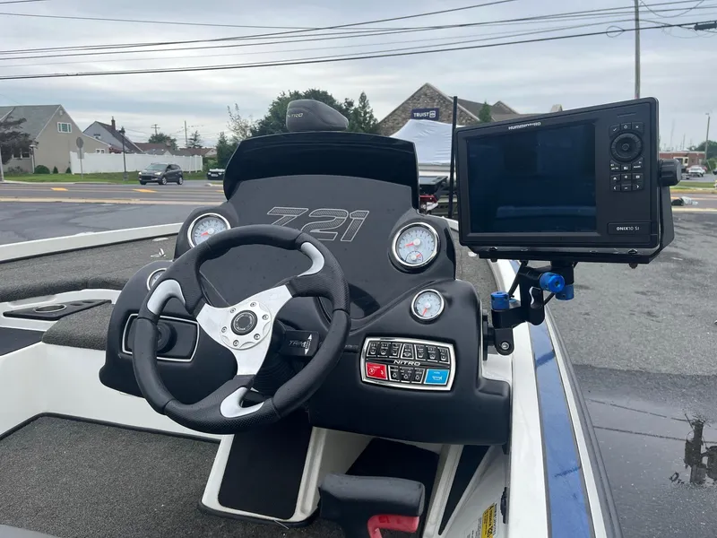 Slide: The Image of 2015 Nitro Z21 Z-Pro boat dashboard with steering wheel and navigation system. - 3