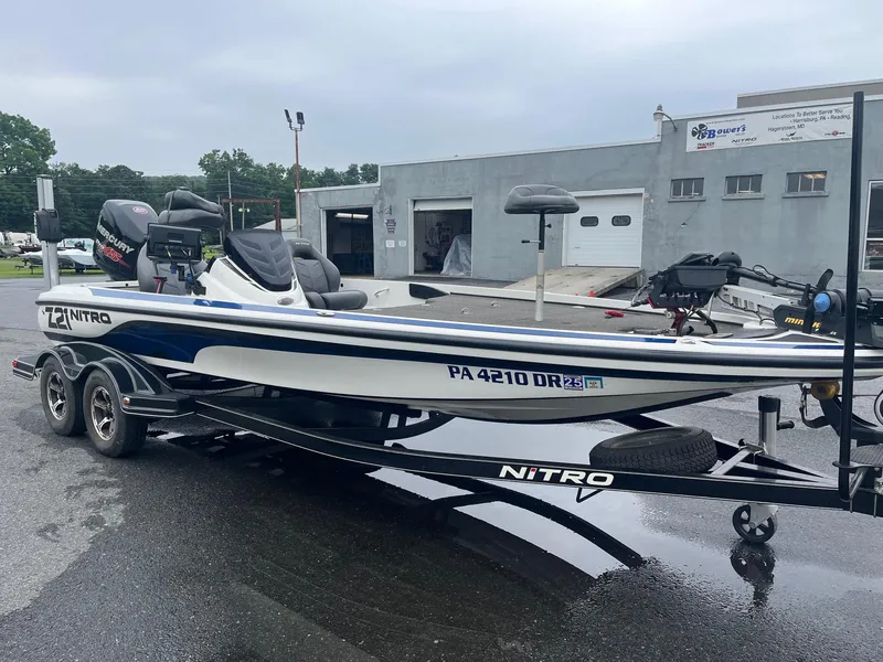 Slide: The Image of 2015 Nitro Z21 Z-Pro High Performance boat on trailer, parked outside a building. - 8