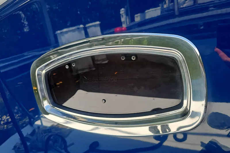 Slide: The Image of Chrome-framed window on a 2014 Sea Ray 470 Sundancer yacht. - 13